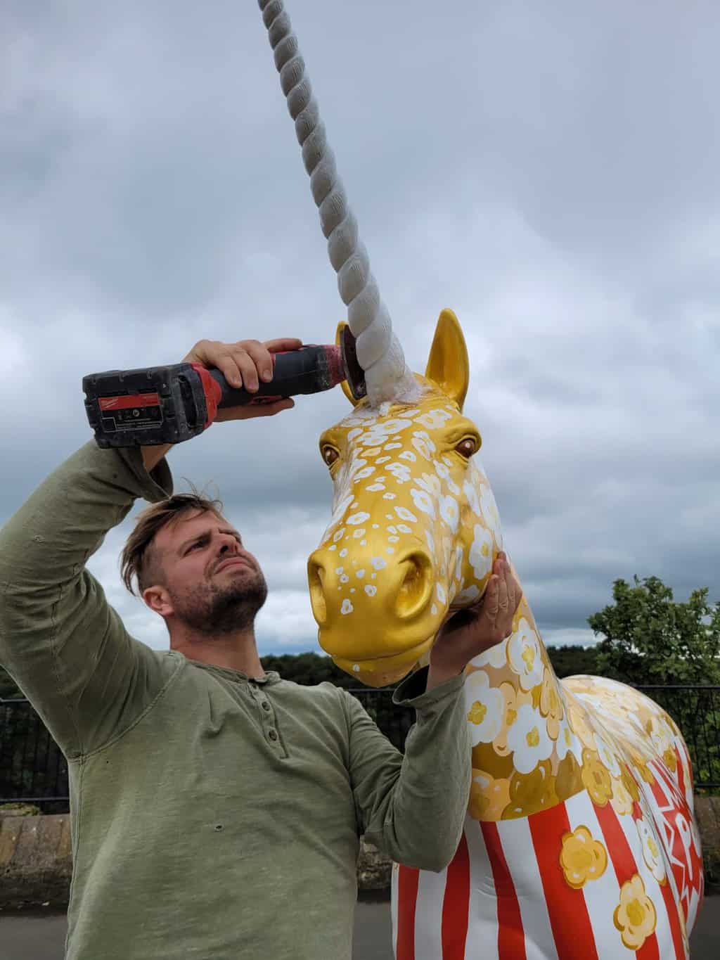 Popcorn being given a new horn in Clifton downs after it was stolen.